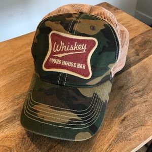 Camo ball cap with Whiskey Round House Bar patch.